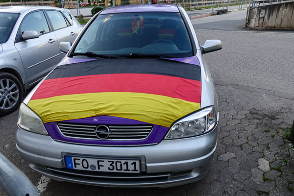 German flag on car hood.